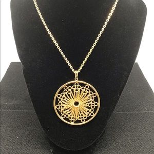 Joan Rivers goldtone starburst lace pendant